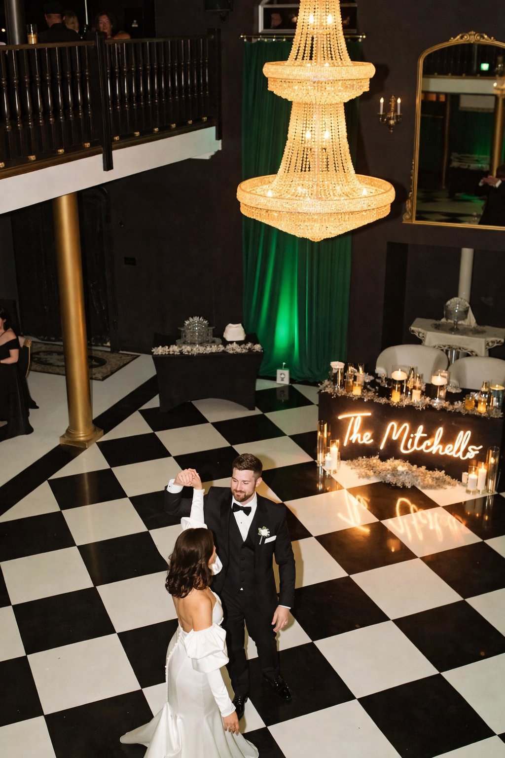 Chandelier lit ballroom with a checkerboard dance floor set up for a Salt Lake City event